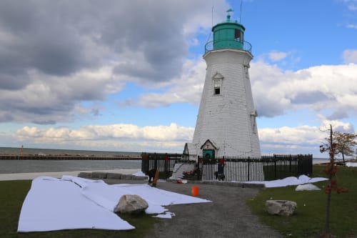 Crews prepare a lighthouse in St. Catharines to film a winter scene for a holiday movie.